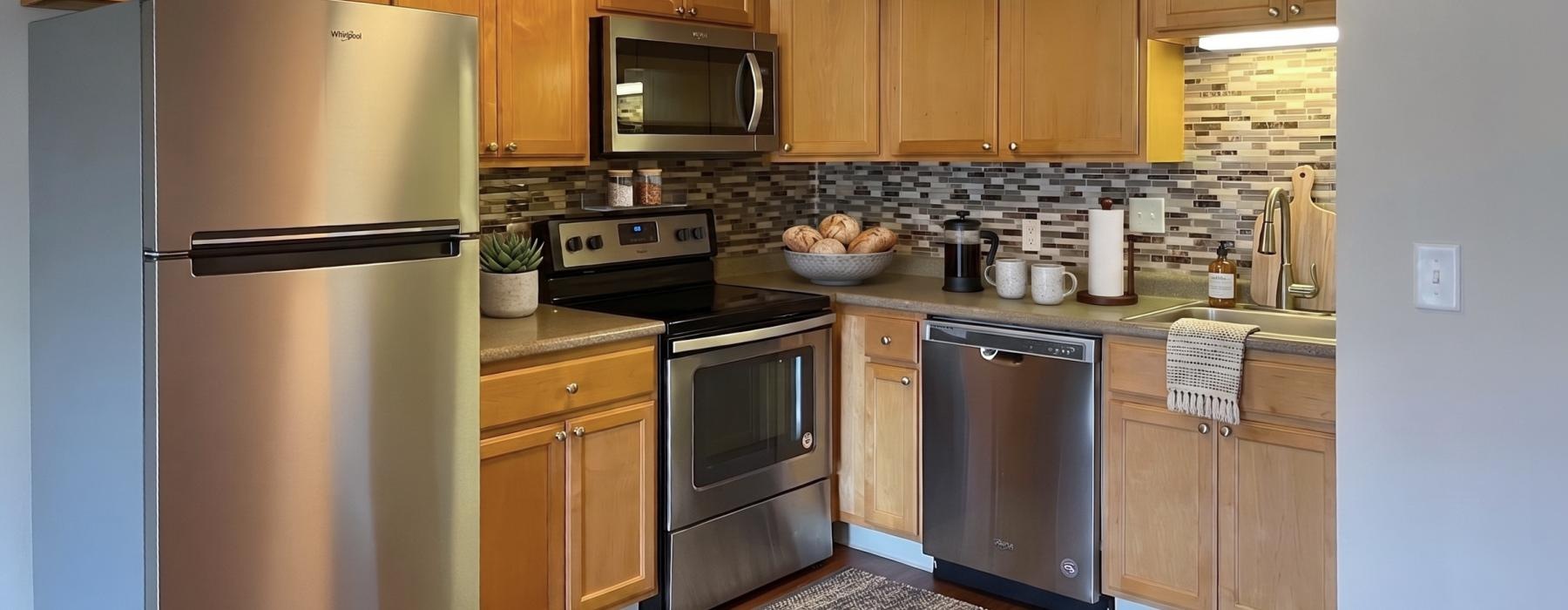 a kitchen with wooden cabinets