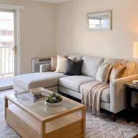a living room with a couch and coffee table