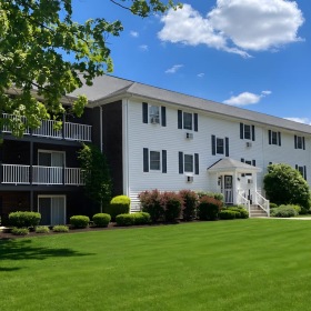 a large house with a lawn in front of it